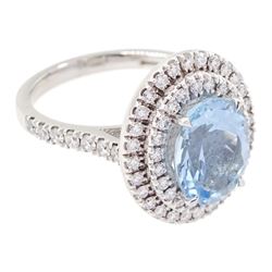 18ct white gold oval cut aquamarine and two row round brilliant cut diamond ring, hallmarked, aquamarine approx 2.40 carat, total diamond weight approx 0.75 carat