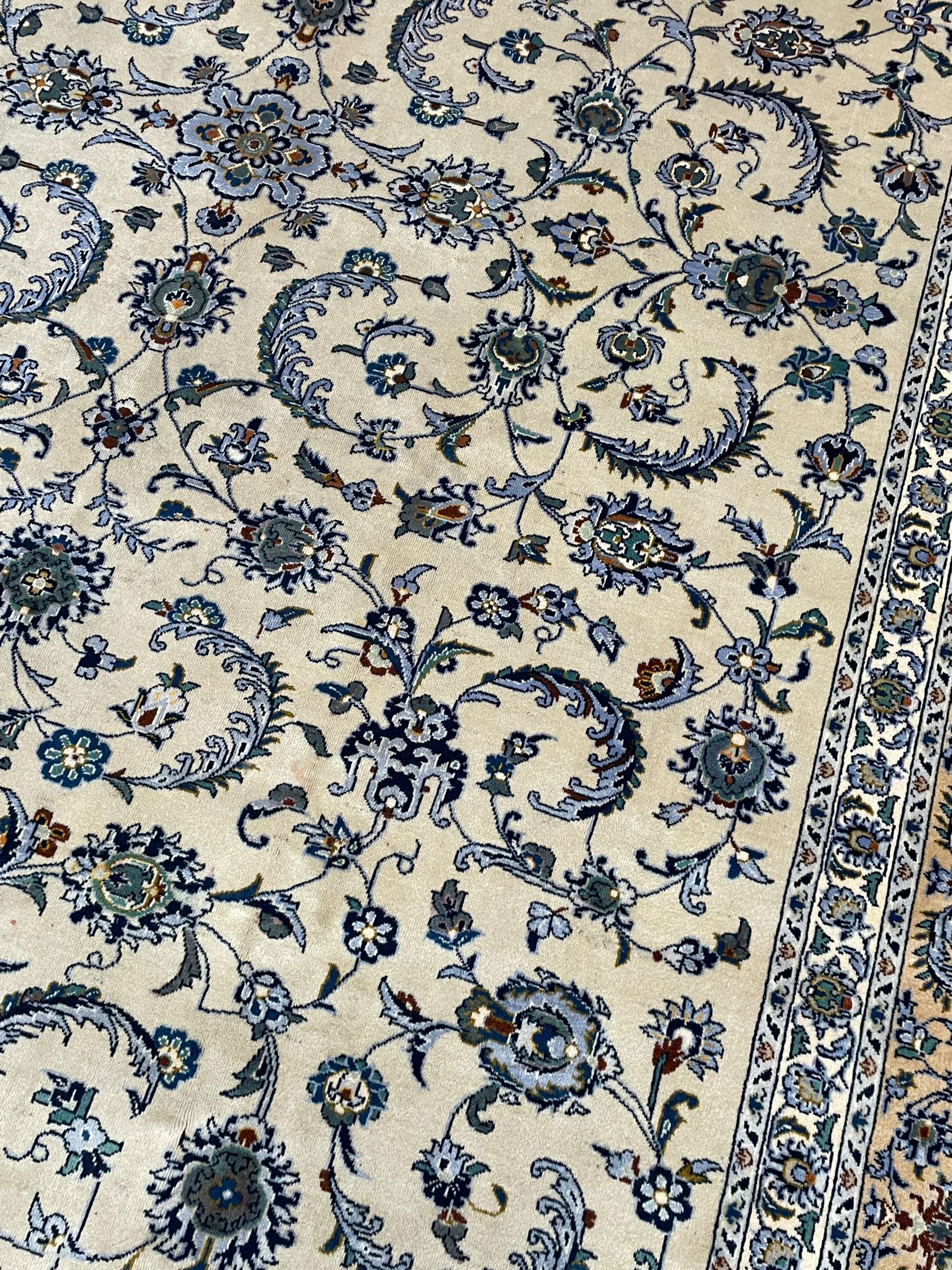 Persian Nain pale sage ground carpet, decorated with curled leaf motifs and palmettes, the busy borders decorated densely with similar design, within floral pattern guard stripes 