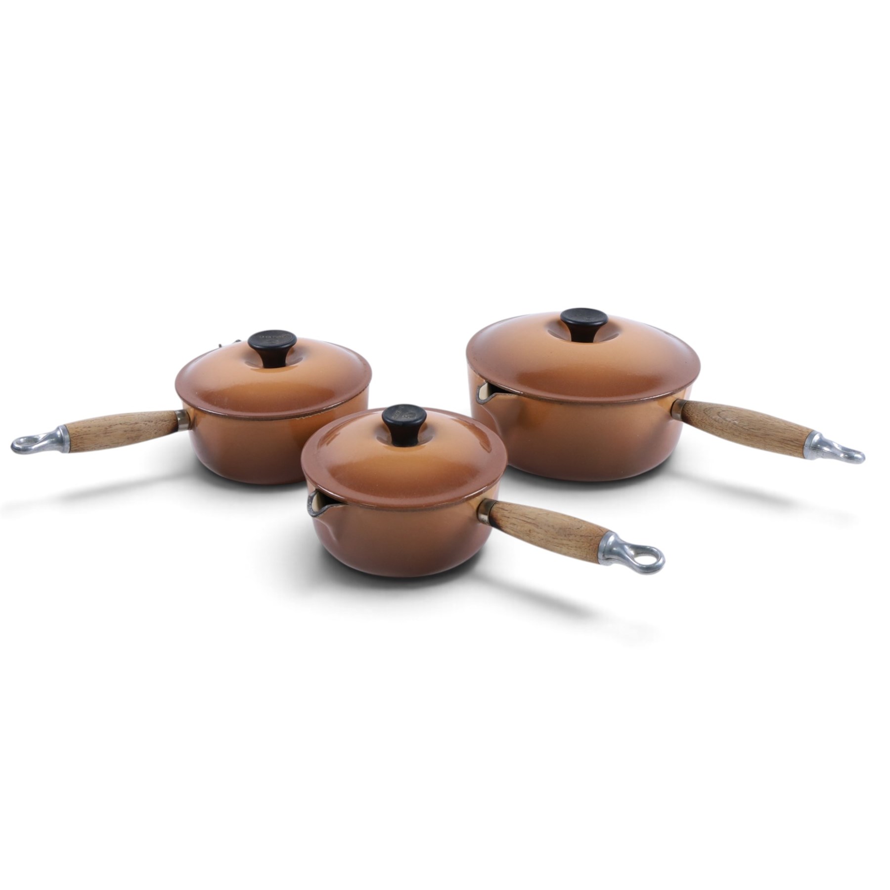 Set of three Le Creuset pans and lid