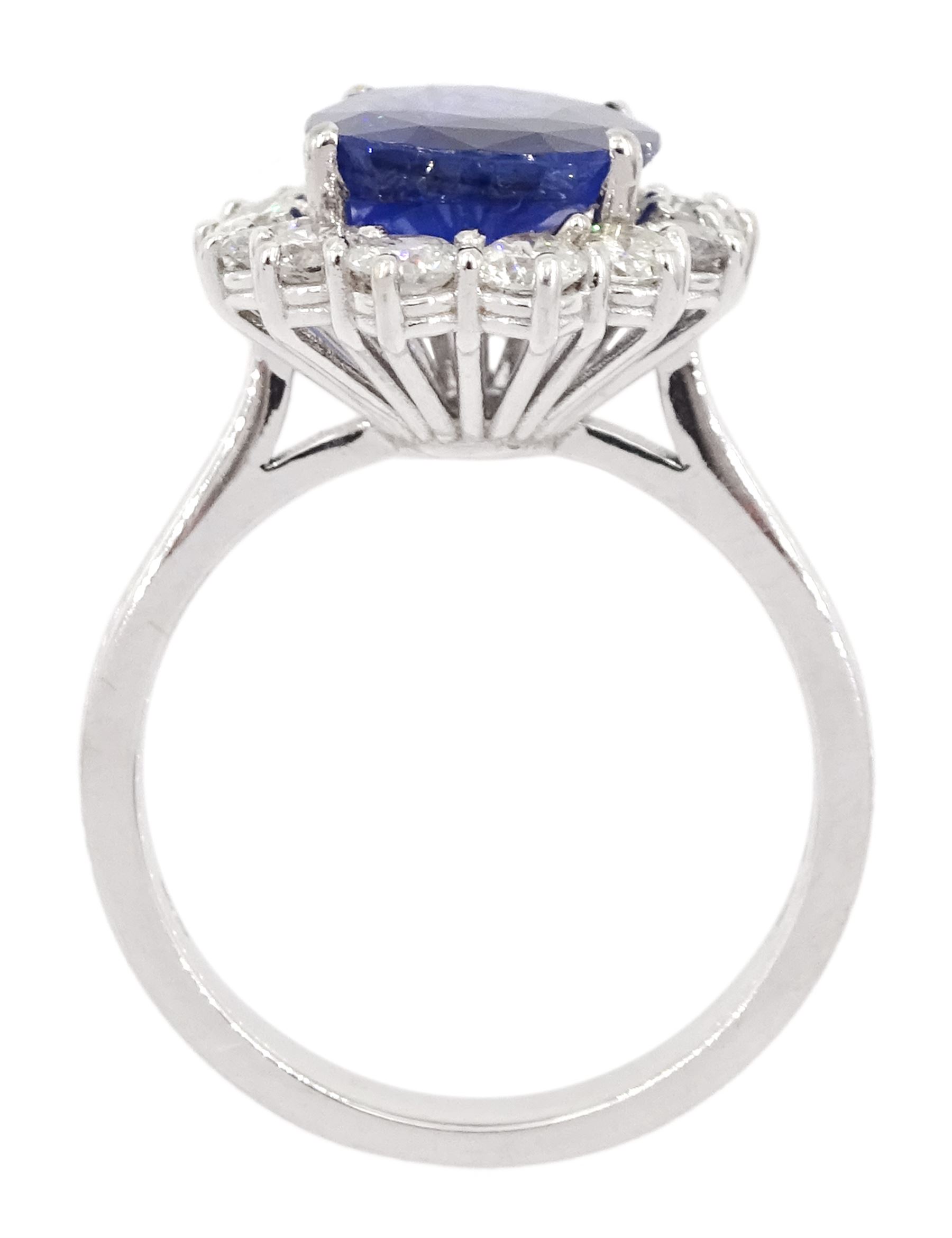 18ct white gold oval sapphire and round brilliant cut diamond cluster ring, hallmarked, sapphire approx 3.50 carat, total diamond weight approx 0.90 carat