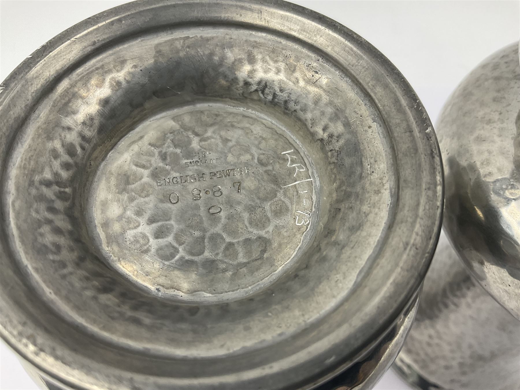 Pair of Liberty & Co Tudric pewter vases, each of bellied form with hammered finish, upon a circular spreading foot, impressed beneath 0987, H12cm