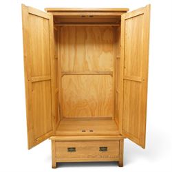 Contemporary light oak double wardrobe, fitted with two panelled cupboards over single drawer
