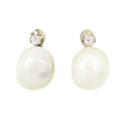 Pair of 19th / early 20th century natural saltwater pearl and diamond earrings, one stud set with a single white / cream pearl, the other with a white / grey / cream pearl, each suspending from a single old cut diamond, total pearl weight approx 4.30 carat