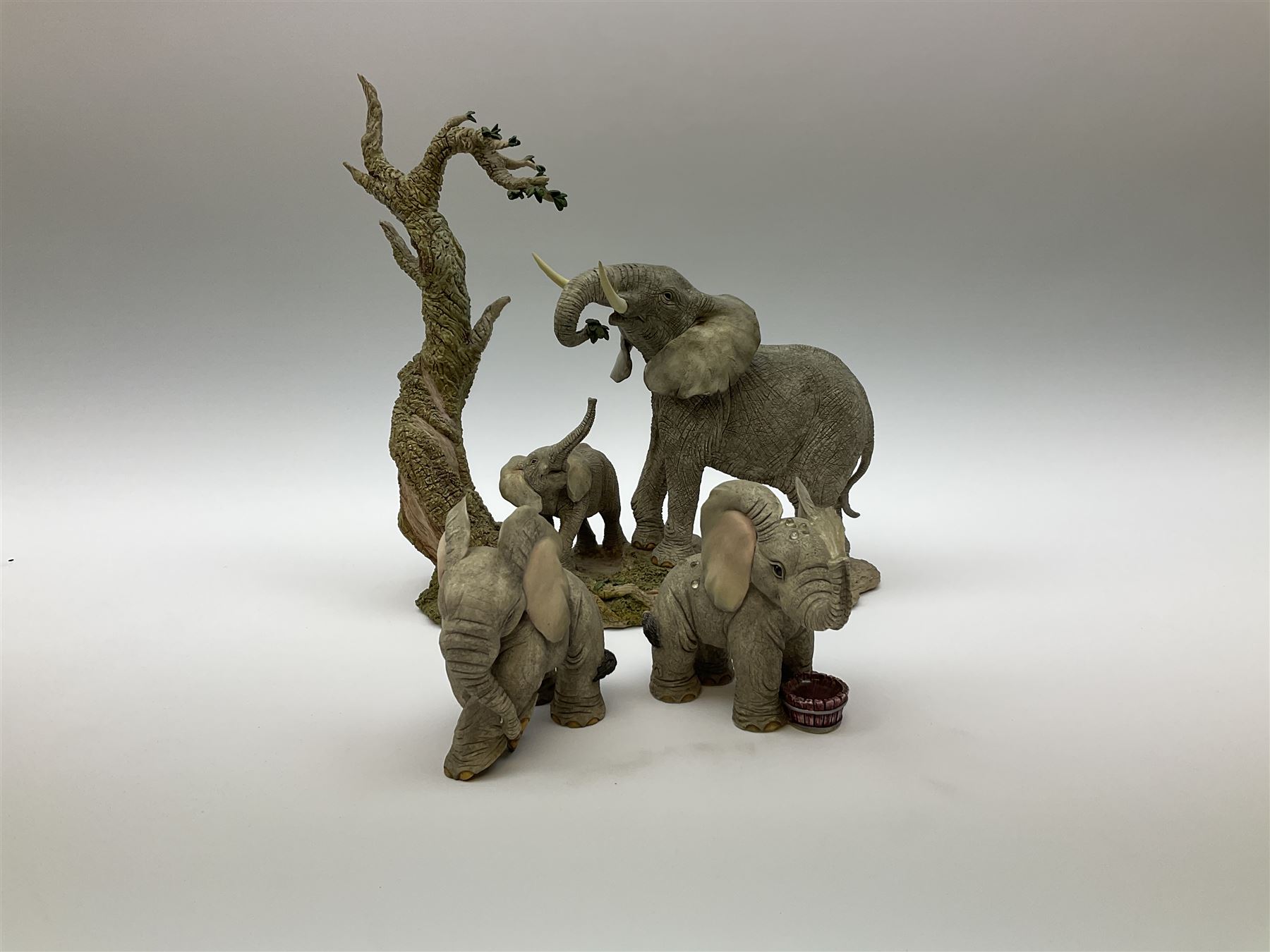 Three Franklin Mint figures, first example On The Prowl, on wooden stand H32cm, L63.5cm, Grizzly, H23cm and American Majesty by Ronald Van Ruyckevelt H37cm, together with five other figures.  
