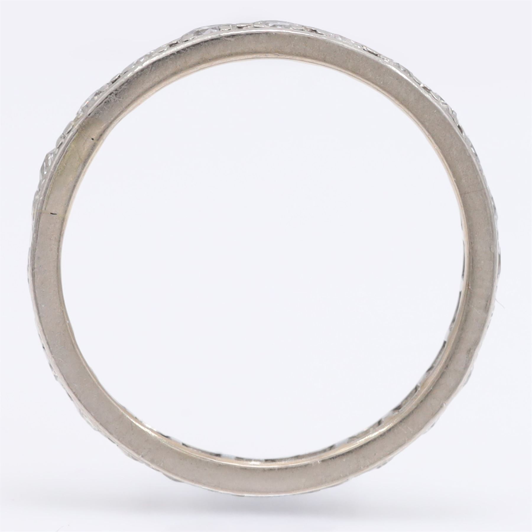 Palladium diamond full eternity ring, set with twenty-three round cut diamonds, total diamond weight approx 0.70 carat
