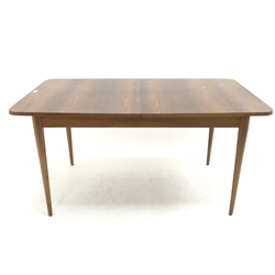 Mid century extending dining table, on teak base, turned tapering supports, W145cm, H72cm D87cm