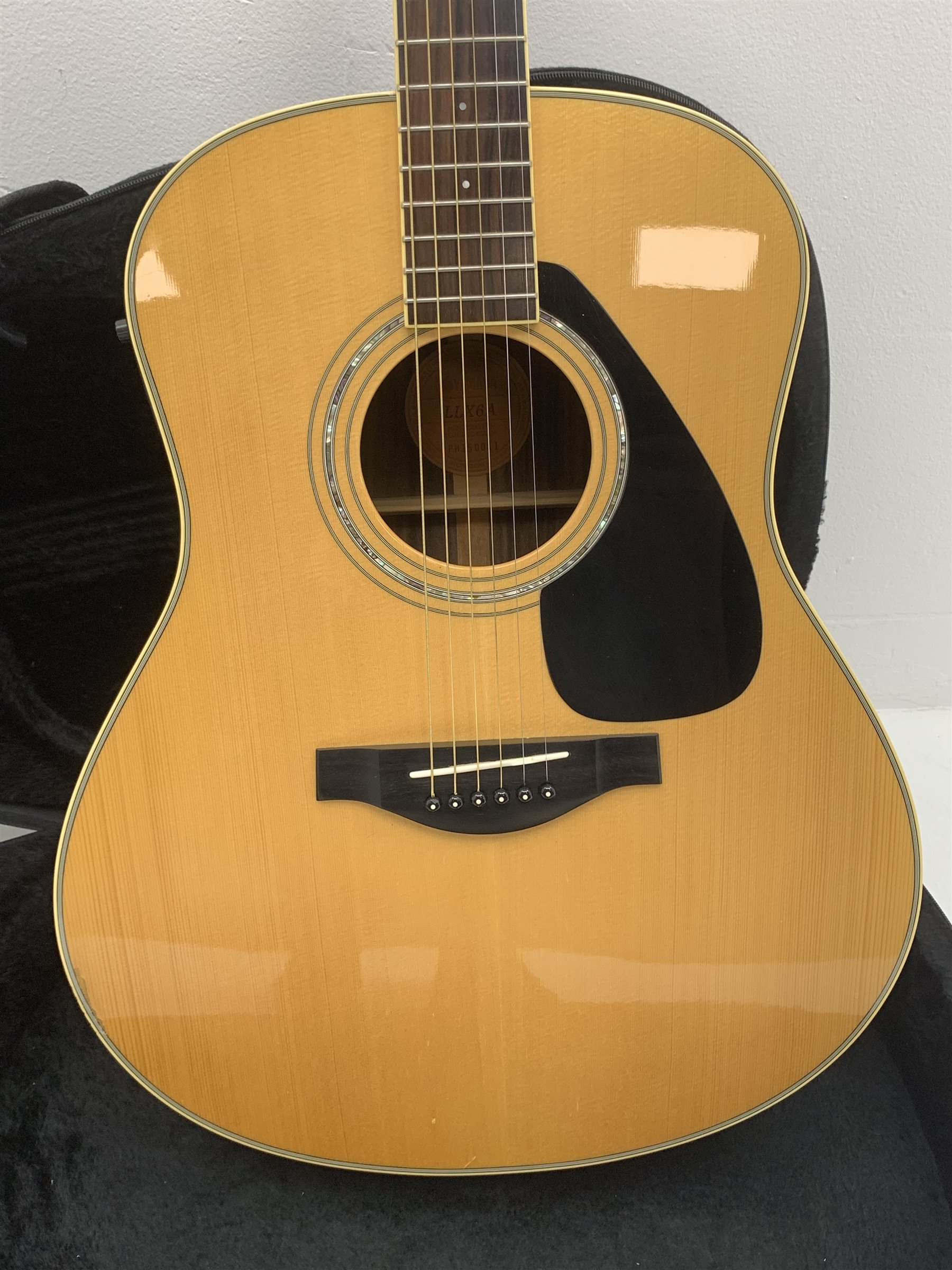  Yamaha model LLX6A acoustic/electric guitar with rosewood back and sides and spruce top, fitted with Yamaha tuner, serial no. QPH150011, L104cm, in hard carrying case. From the collection of the late John Burgess of Beverley who played in the bands Penjants, Wine, Strollers, Revox, Sound Foundation, Pickle Belly Alley, Ragamuffins and Jerryattricks.