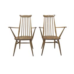 Ercol - pair elm and beech 'Windsor' open armchairs, shaped cresting rail over stick back, on tapered supports joined by H-stretchers