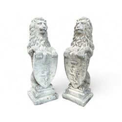 Pair of large cast stone Langport garden lions, holding shield, raised on stepped base