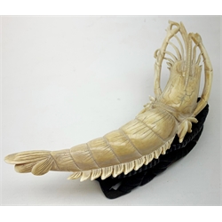 19th century Japanese carved ivory model of a crayfish, with accompanying wooden stand, L20cm

