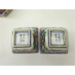  Pair of 19th century Chinese Wucai square dishes, Wanli six character mark to base, L11cm x W11cm and a Japanese Meiji period shaped lidded box and cover decorated in the Imari pallet with overlapped moulded lid, L19cm (3)  