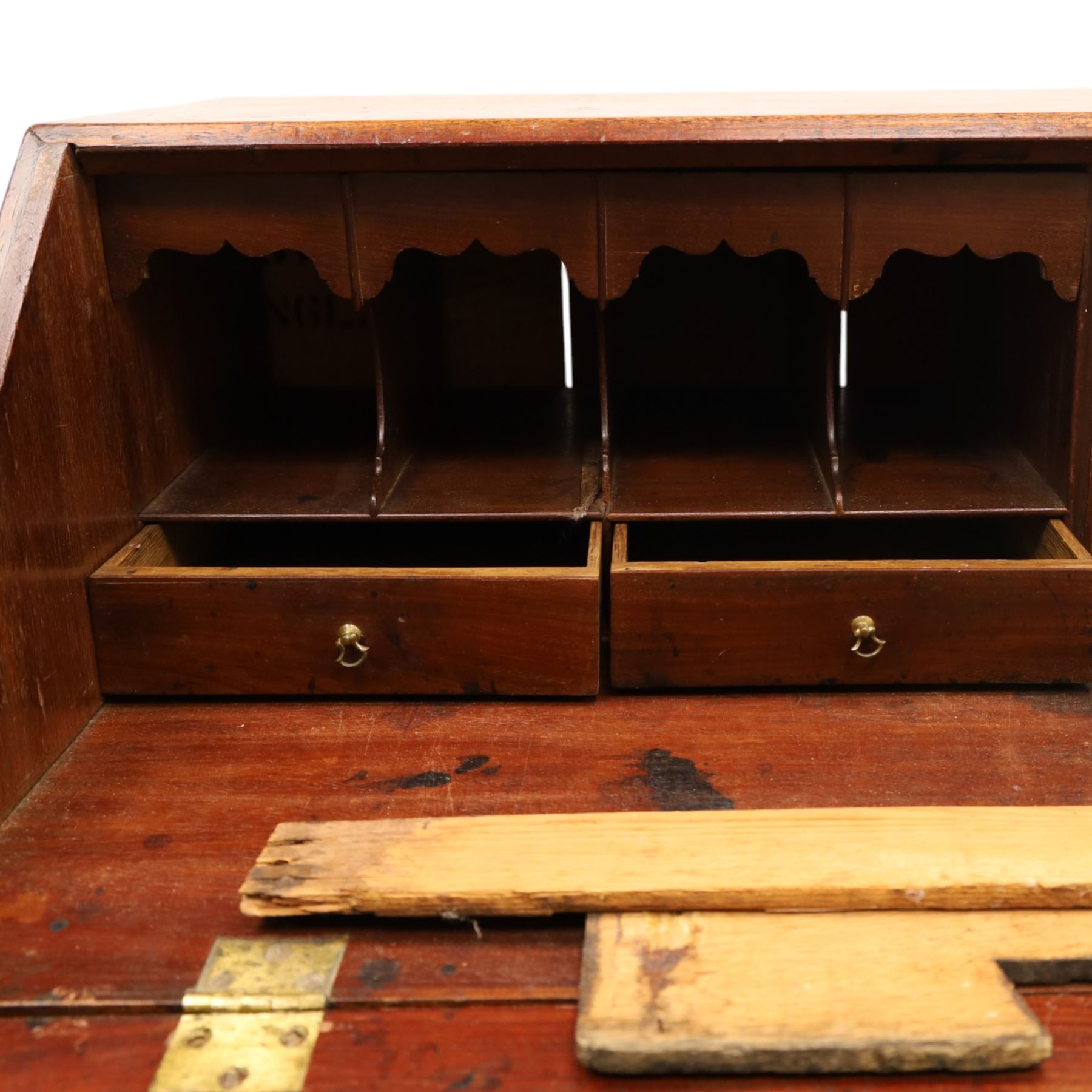 George III mahogany bureau of large proportions, the fall-front enclosing fitted interior with fluted column secret compartments and assorted pigeonholes and correspondence drawers flanking central cupboard, over four graduating cock-beaded drawers with original brass swan-neck handles, raised on bracket feet