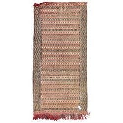 Moroccan Berber rug, pale red ground, decorated with horizontal geometric pattern bands, lozenge pattern upright bands