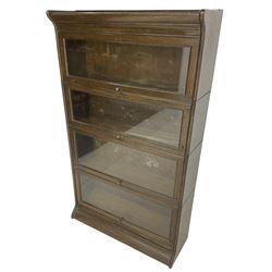 Early 20th century oak stacking library bookcase, four sections with hinged and sliding glazed doors