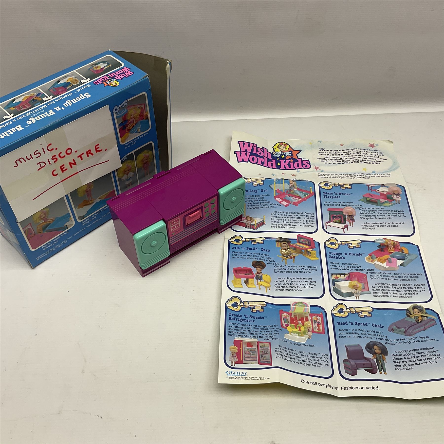 Wish World Kids - Eleven play sets comprising Treats ‘n Sweets Refrigerator, Grin ‘n Win TV, Sponge ‘n Plunge Bathtub, Socks ‘n Locks Dresser, Spice ‘n Slice Stove, Sleep ‘n Leap Bed, File ‘n Smile Desk, Blaze ‘n Braise Fireplace, Hear ‘n Cheer playset in Sponge ‘n Plunge box, two Read ‘n Speed Chair playsets in one box