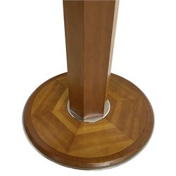 Art Deco design maple and cherry wood pedestal table, circular top with figured quarter matched veneers, mounted by chromed metal band, octagonal pedestal on circular platform base