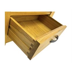 Contemporary light oak wine cabinet, rectangular overhanging top above an open shelf, fitted with four bottle racks each holding three bottles, single drawer with curved metal handle, on chamfered supports