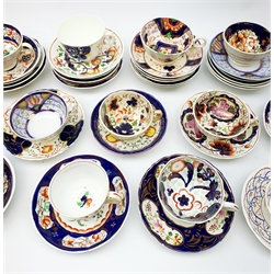  A large collection of assorted Gaudy Welsh style cups and saucers, each decorated with various floral designs in a palette of blue, red and pink, many examples with lustre detail. (Approx 34).   