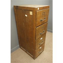  Early 20th century 'Abbess' oak four drawer filing cabinet, brass pull handles, plinth base, W46cm, H132cm, D69cm  