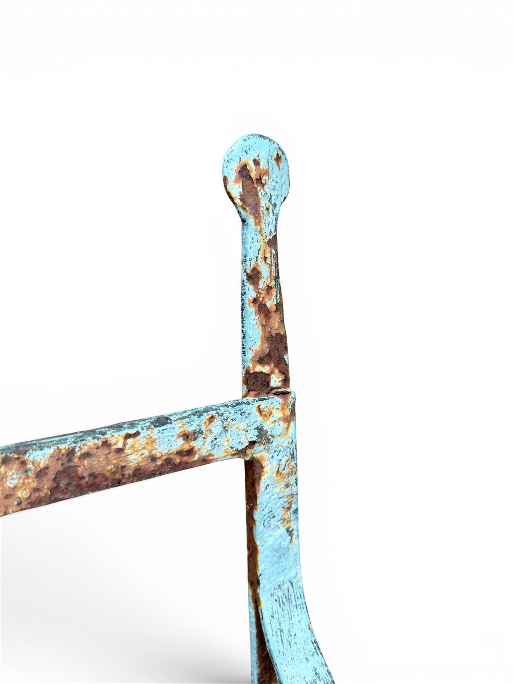 Regency period wrought iron strapwork garden bench, cresting rail with central Scottish thistle motif and flanking pediments, in distressed blue painted finish