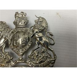 Victorian Volunteer Medical Staff Corps white metal helmet plate in the form of Victorian crowned Royal Arms with three part lower scroll for “VOLUNTEER MEDICAL STAFF CORPS”; three lug fittings to the reverse L8.5cm