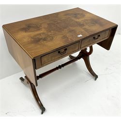 20th century inlaid walnut drop leaf sofa table, two drawers 
, pierced harp shaped supports joined by turned stretcher on brass hairy paw feet