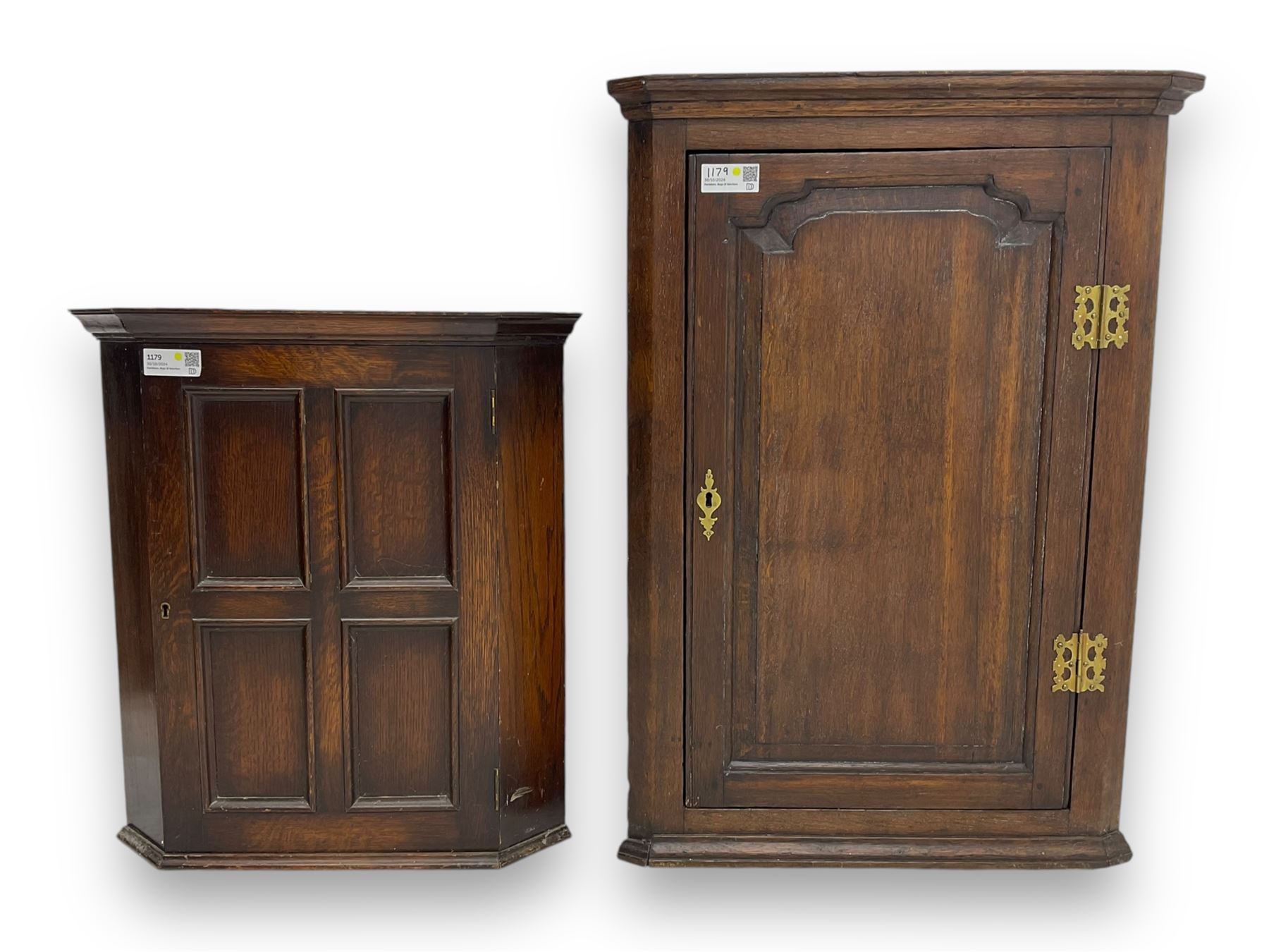 Early 20th century wall mounted oak corner cabinet, moulded cornice over panelled door enclosing single fixed shelf (W60cm, D40cm, H66cm); 19th century oak corner cabinet, panelled door enclosing three shaped shelves (W65cm, D35cm, H92cm)
