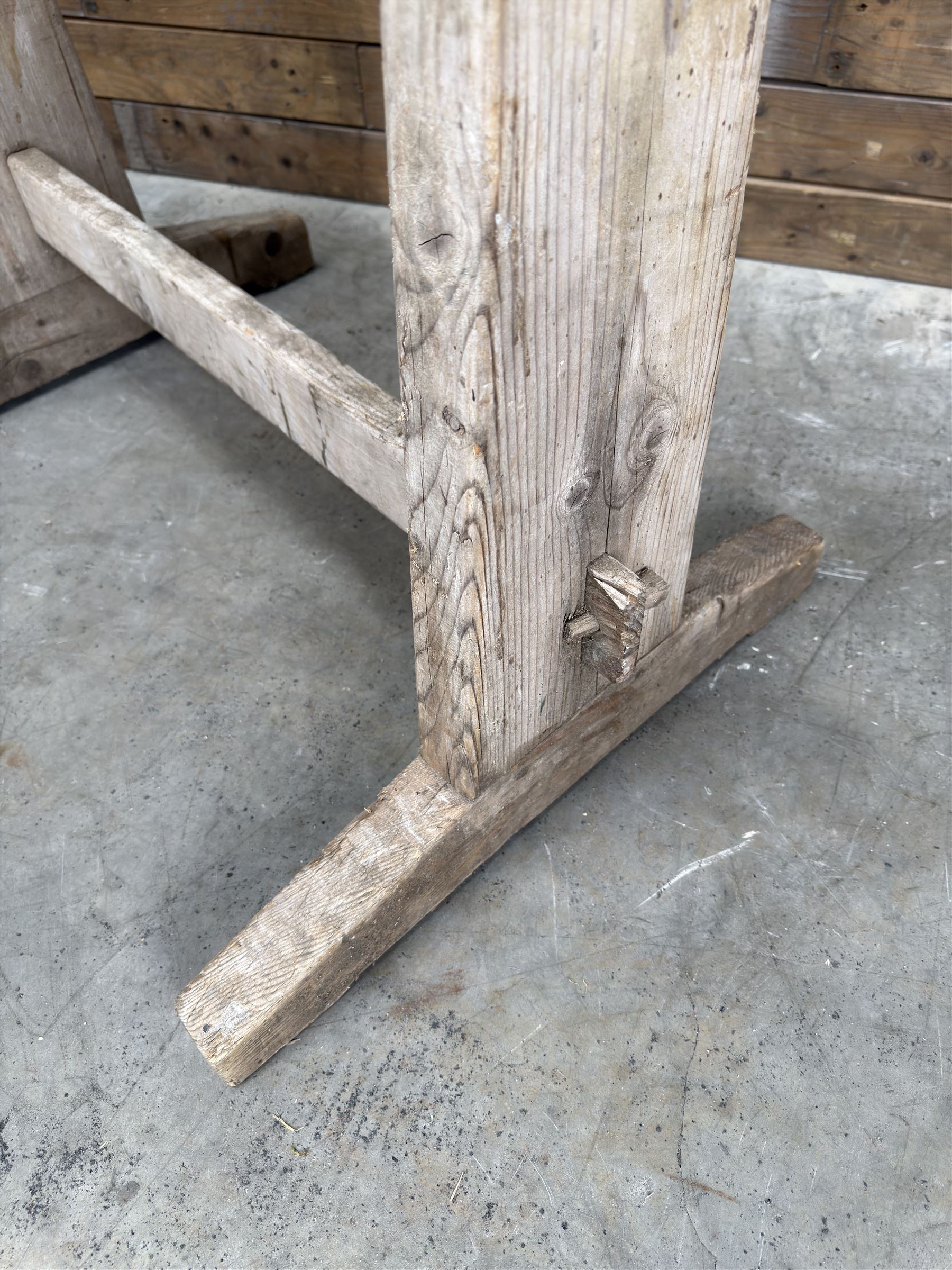 Pair of late 19th century pitch pine trestles, square tapering form in stripped finish