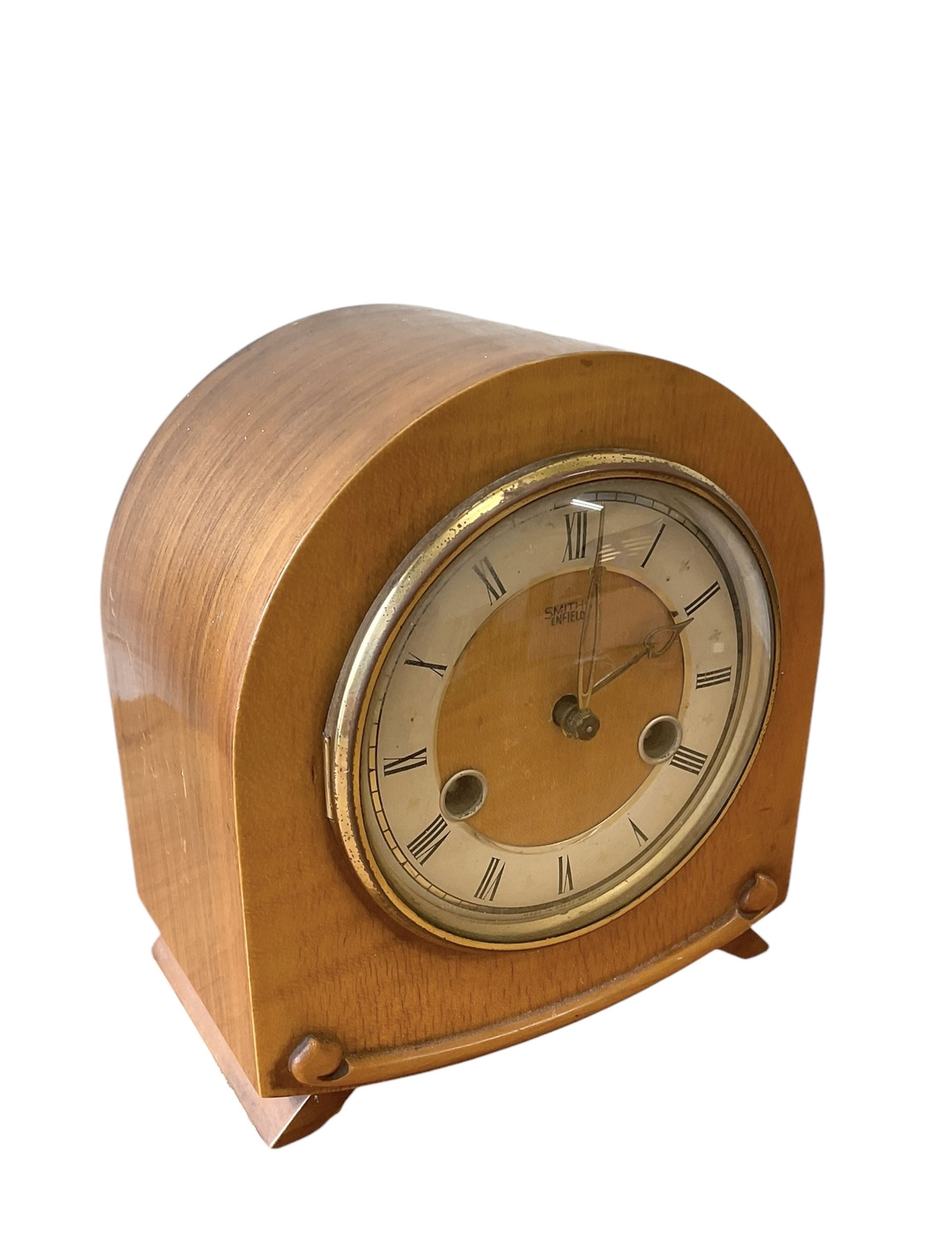 20th century- Hermle 8-day moon phase three train bracket clock, with a brass dial and subsidiary moon dial, floating balance escapement chiming the quarters on 5 gong rods. With an English oak cased Smiths Enfield 8-day striking mantle clock c1950. With pendulum and key.  