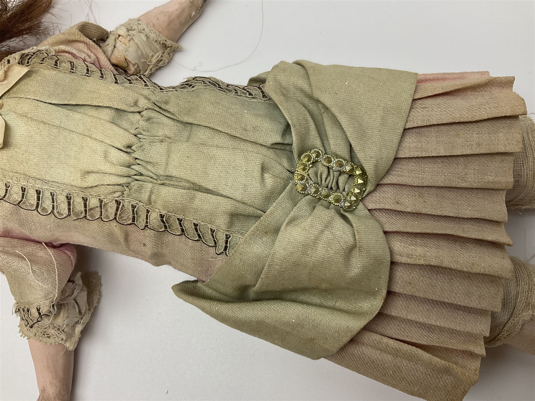 Victorian wax shoulder head doll with applied hair, inset glass eyes and jointed body with composition lower limbs; faded pink dress H35cm