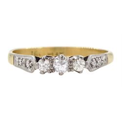 Gold three stone diamond ring, with diamond set shoulders, stamped 18ct Plat 