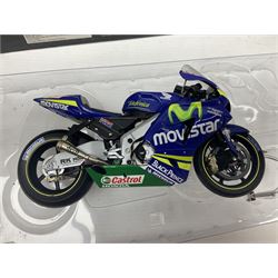 Four Minichamps 1:12 scale die-cast motorcycles - Honda RC211V Team Movistar Honda MotoGP Rider Marco Melandri MotoGP 2005; Yamaha YZR-M1 Antena 3 Yamaha D'Antin Shinya Nakano MotoGP 2003; Yamaha YZR-M1 Max Biaggi MotoGP 2002; and Ducatti 999FO4 Gregorio Lavilla BSB 2005; all boxed (4)