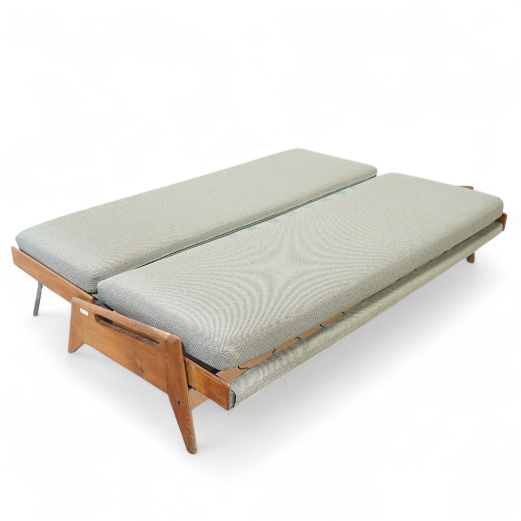 Gerard Guermonprez for Bobois - mid-century light teak sofa daybed, sides with angular teak wire sprung frame, integrated armrests with cut-out hand-holds, single fabric cushion back and seat, on out-swept tapered legs, circa 1955