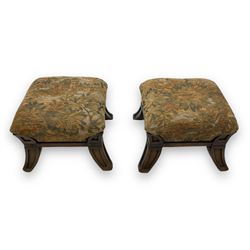 Pair of early 20th century miniature footstools, square seat covered in gold and orange floral patterned tapestry fabric, on carved wooden frame with splayed supports 