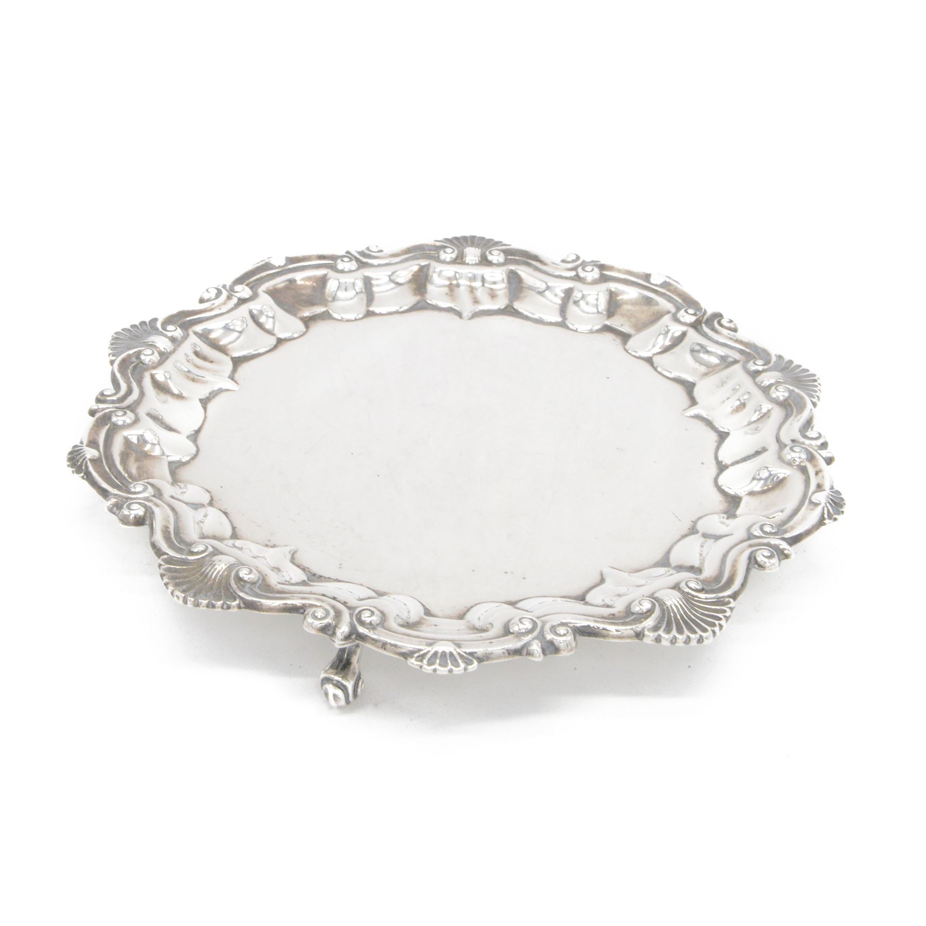 Edwardian silver waiter, of typical form with palmette and C scroll rim, upon three scroll feet, hallmarked Chester 1909, maker's mark MEB over FEB, W23cm