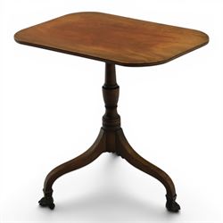 George III mahogany tripod table, rounded rectangular tilt top, raised on a turned column, on splayed supports, terminating brass claw feet above castors