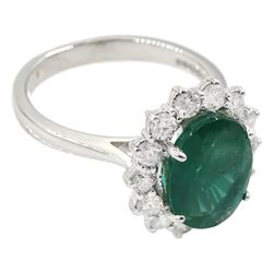 18ct white gold oval emerald and diamond cluster ring, hallmarked, emerald approx 3.20 carat, total diamond weight approx 0.60 carat