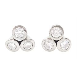Pair of white gold bezel set, round brilliant cut diamond cluster stud earrings, total diamond weight approx 0.65 carat