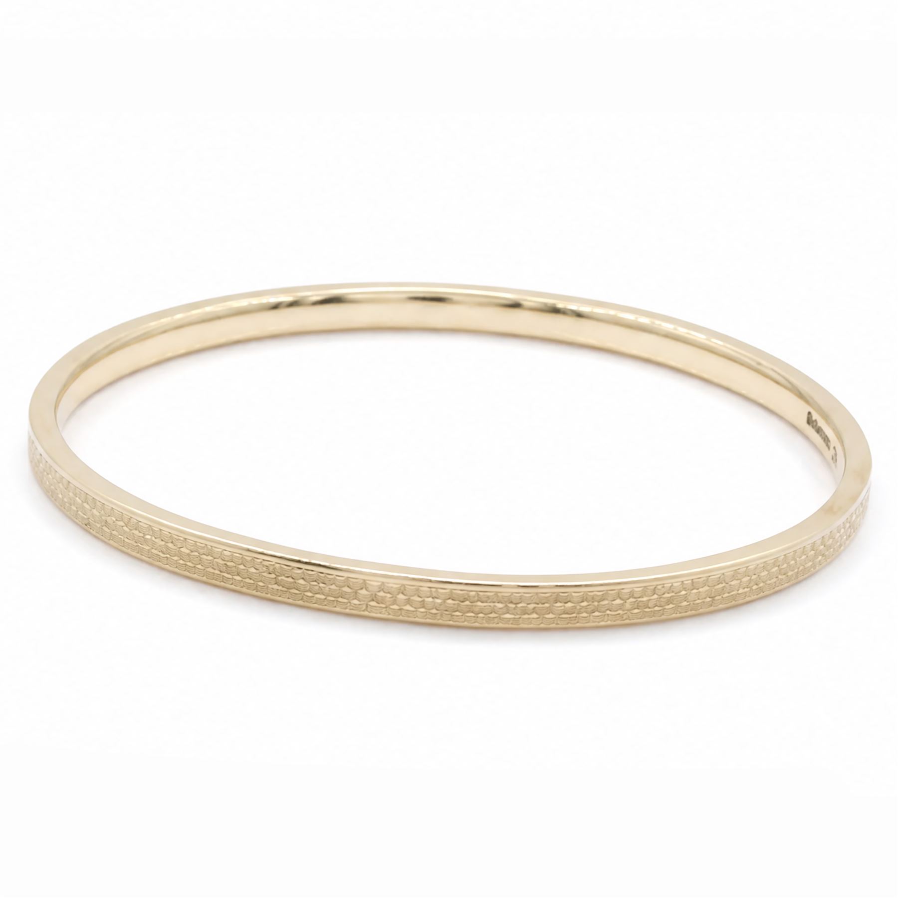 Early 20th century 9ct gold arm bangle, with engine turned decoration by Deakin & Francis Ltd, Birmingham 1922