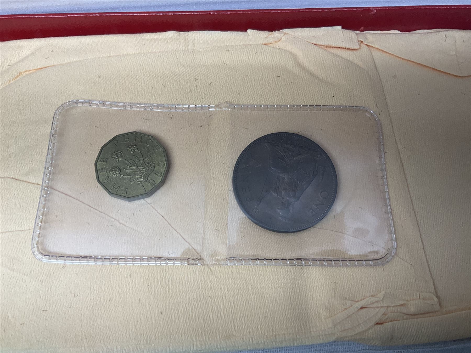 Four King George VI 1950 specimen coin sets, each comprising farthing, half penny, penny, threepence, sixpence, English  one shilling, Scottish one shilling, two shillings and half crown, each in red Royal Mint card case