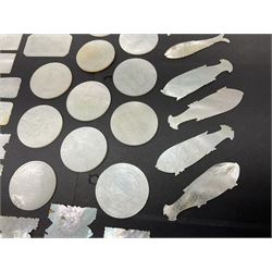 Collection of fifty seven Chinese mother of pearl gaming counters or tokens, of various size and form including rectangular, circular and fish shaped examples, various decoration including floral motifs, largest rectangular examples L6cm