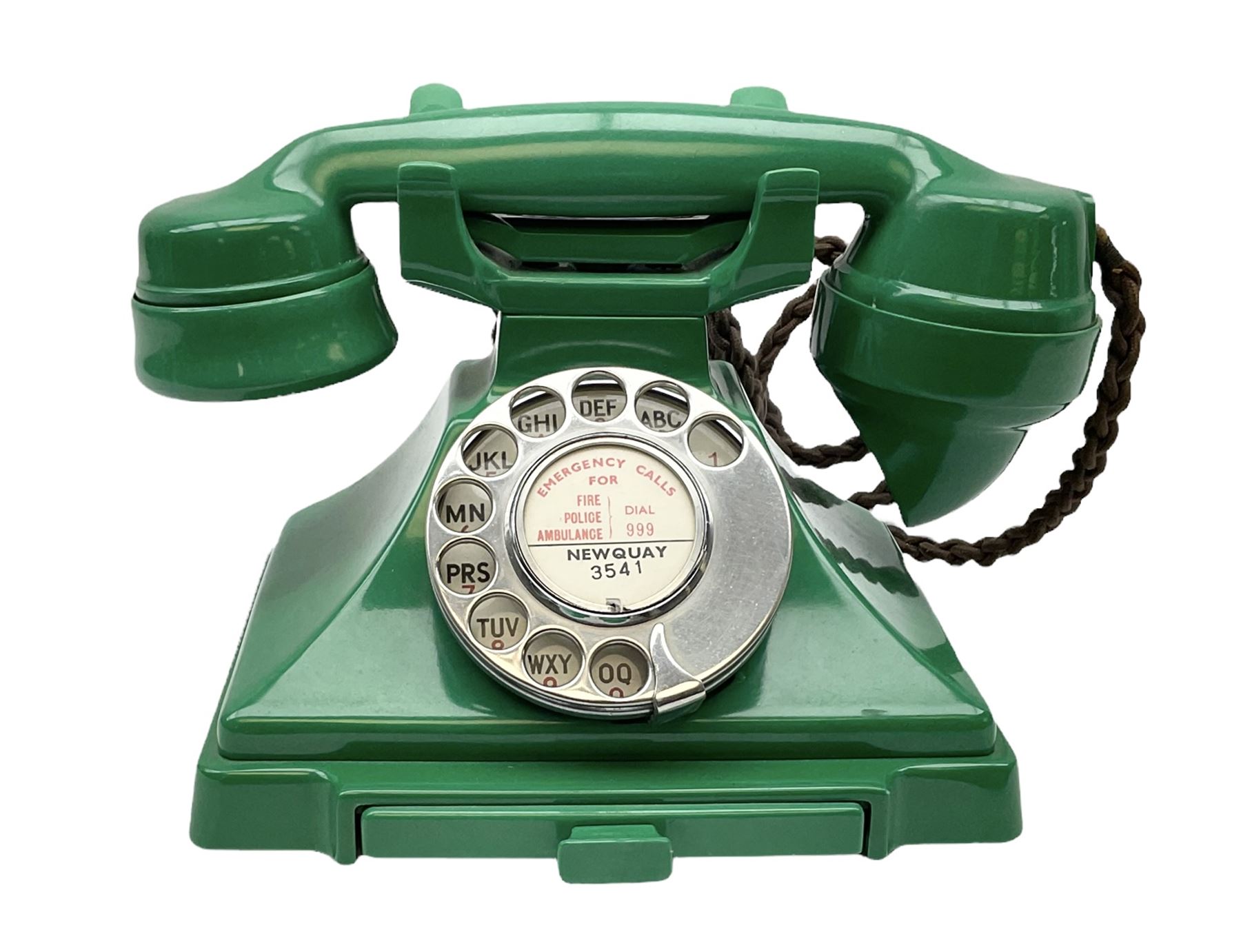 Jade green Bakelite telephone, of pyramid form with rotary alphabet dial, brown braided handset cord and a base draw, W18cm D14cm H15cm
