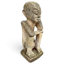 Balinese design weathered cast stone figure of an ancestral guardian, modelled in a squatting pose 