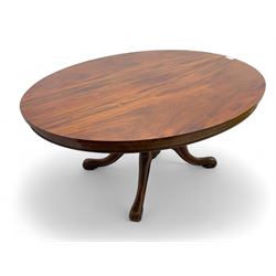 Victorian mahogany breakfast loo table, oval tilt-top on turned pedestal, quatrefoil out-splayed carved supports, scroll carved terminals with brass castors