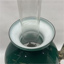 William H Honey polished brass adjustable student's oil lamp, with green glass shade, H60cm