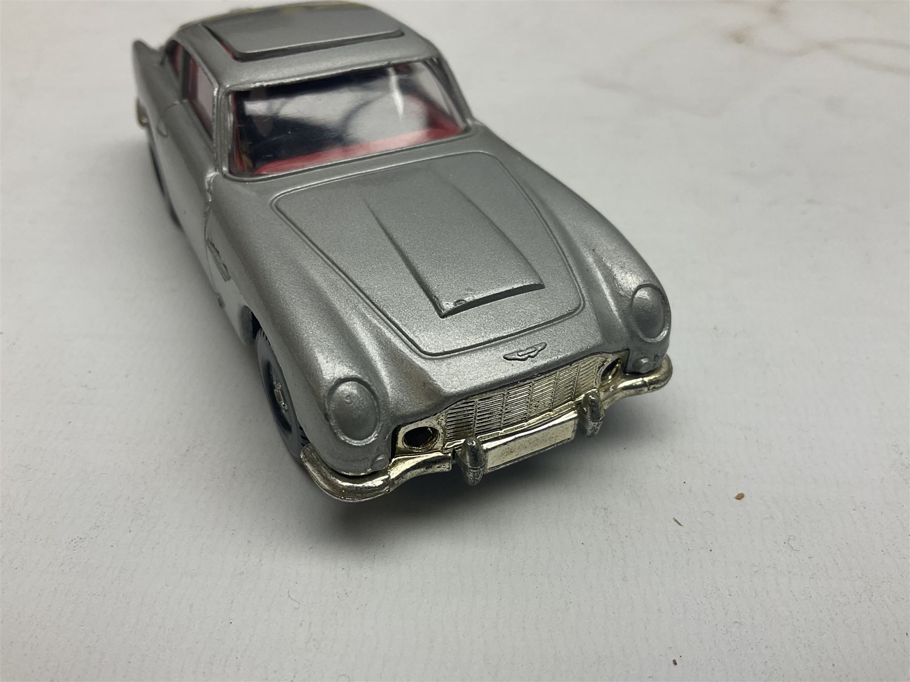 Corgi - die-cast model of James Bond Aston Martin DB5 No.271 with silver body and red interior, gold bumpers and four-spoke wheels, James Bond and two bandit figures; original window box with header card; and Dinky Shado 2 Mobile with one missile No.353; in window box (2)