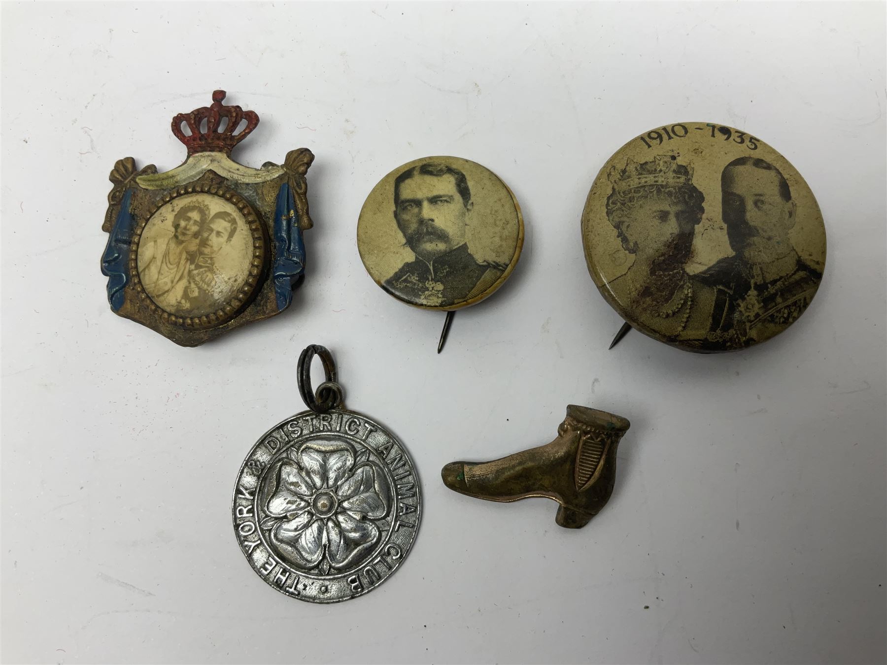 Made-up group of three WWI medals comprising 1914 Star awarded to 23598 Gnr. F. Jefferson R.G.A., British War Medal and Victory Medal with names removed; with ribbons on wearing bar; 1942 Motorist's Medal and small quantity of cap badges, Royalty badges etc