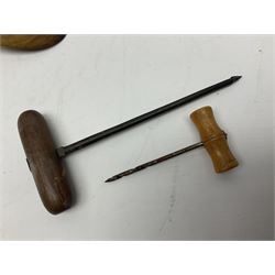 Two wooden biscuit moulds, carved loving spoon and fork, and two bradawls 