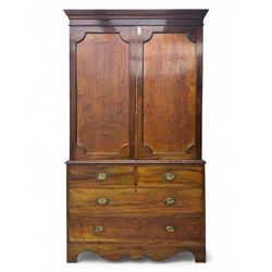 George III mahogany linen press cupboard, projecting moulded cornice over two panelled doors, the interior fitted with two slides and shelf, two short and two long drawers below, shaped apron over bracket feet 
