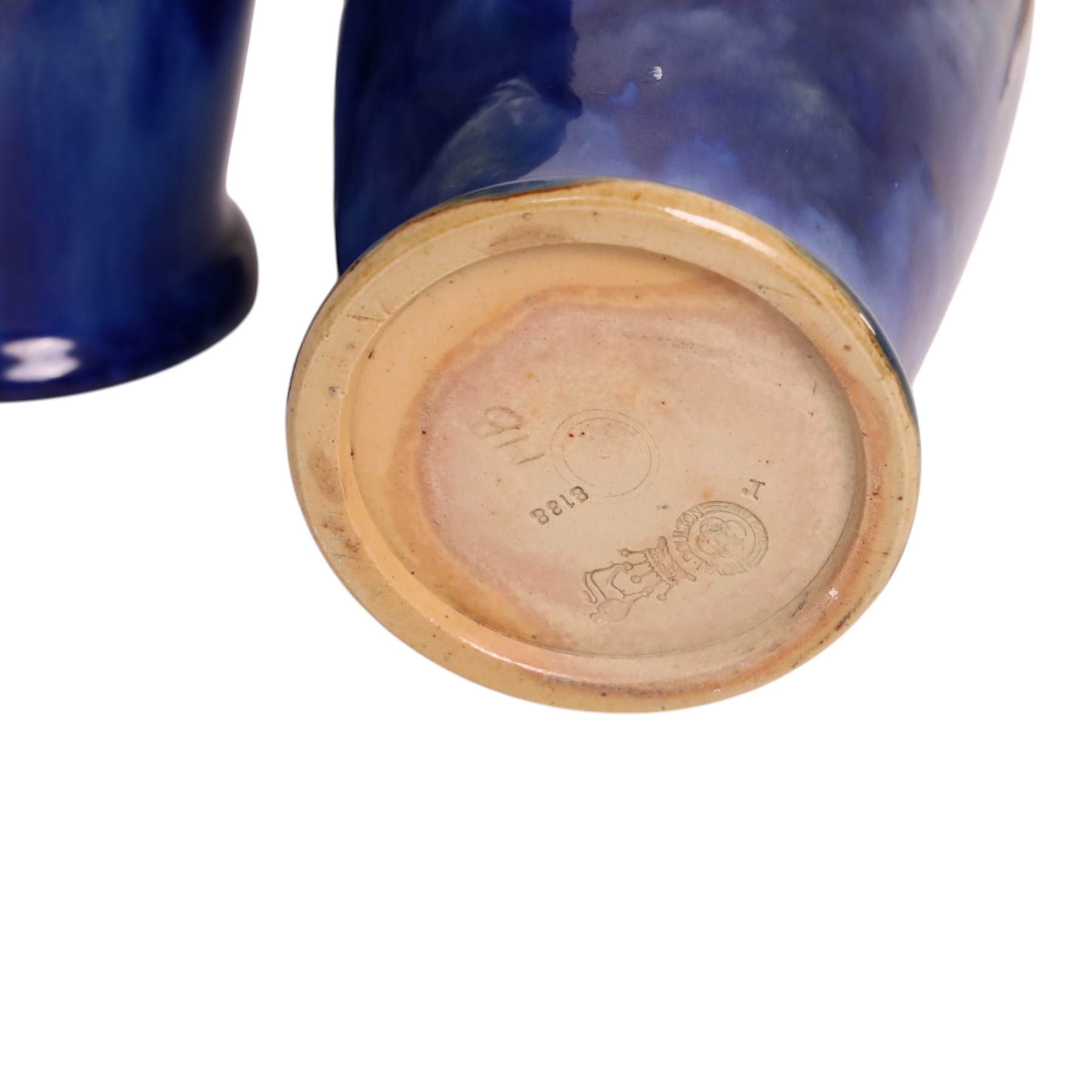 Royal Doulton - Pair of Art Nouveau vases, designed by Francis Pope, with scroll work to the collar, in tones of green and blue, with impressed mark and no. 8138 beneath, H26cm